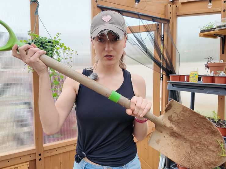 woman holding a shovel
